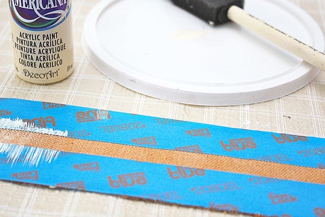 Painting stripes onto the paint dipped drop cloth soap wraps!