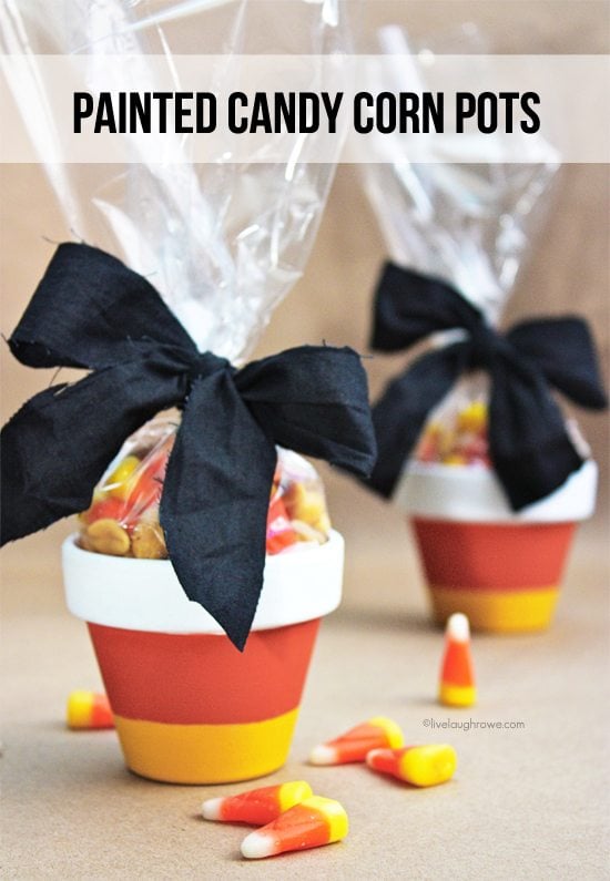 Fabulous and Easy Painted Candy Corn Pots. Great for treat giving. Tutorial at livelaughrow.com #candycorn