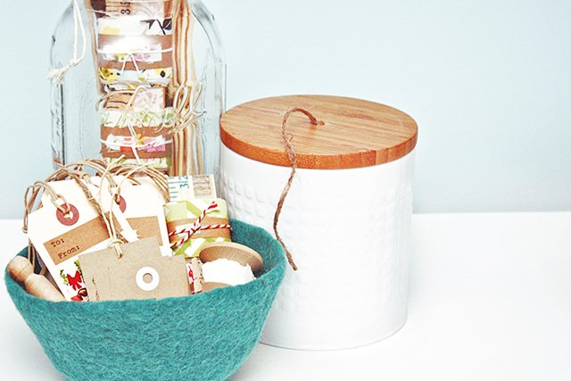 Turn an everyday canister (with a lid) into a DIY project! This DIY Twine Holder is a great way to keep your jute twine organized. livelaughrowe.com