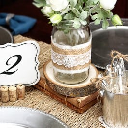 Loving these rustic jar wraps for a vintage wedding tablescape. Everything looks more rustic with a little burlap, right? livelaughrowe.com