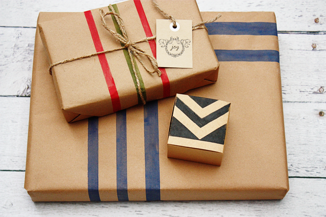 Create your own wrapping paper with painter's tape and kraft paper.  Tutorial at livelaughrowe.com
