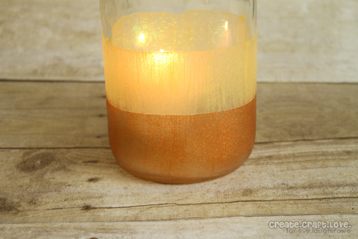 These Candy Corn Luminaries are the perfect addition to your fall or Halloween decor! via createcraftlove.com for livelaughrowe.com #fall #halloween #luminaries #candycorn
