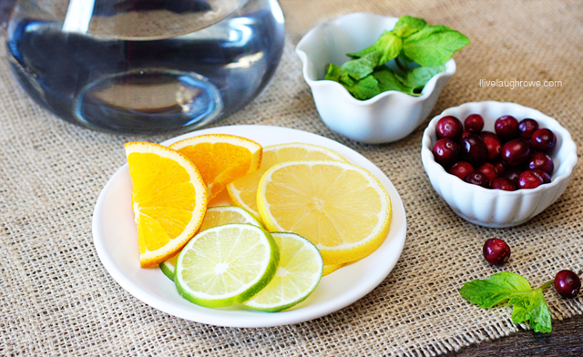 Using fruits and vegetables, create a flavored water bar for your guests.  Details at livelaughrowe.com