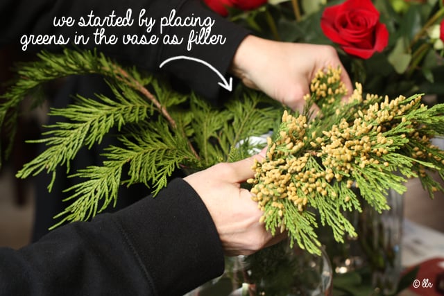 when adding some fillers, start by placing that in your vase around the edges