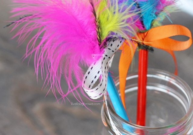 Super fun craft for the kids! Feather Topped Pencils. Tutorial at livelaughrowe.com