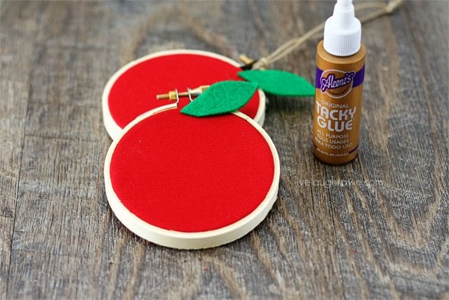 Attach leaf to Apple Hoop Art with glue.