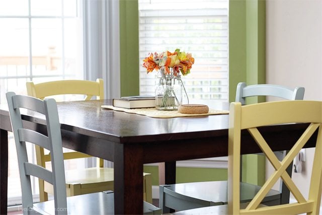 Love how these colorful cottage style chairs brighten up our breakfast room!