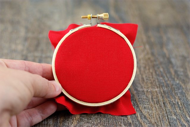 Place fabric in the hoop and trim (or glue to back).