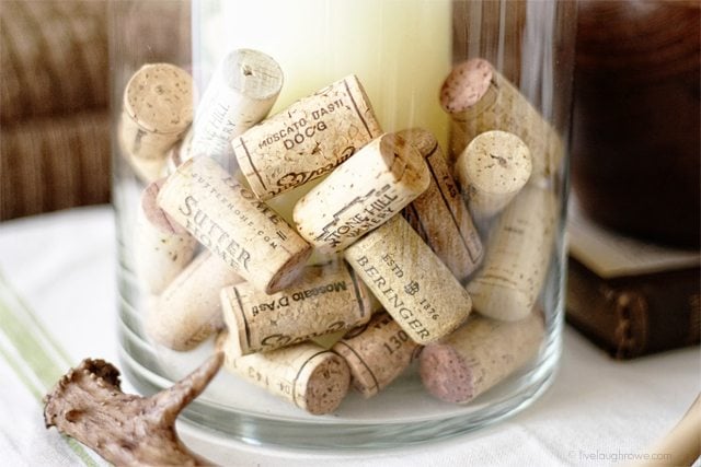 A simple and cost effective vase filler! Use your growing collection of corks as vase fillers... www.livelaughrowe.com #DIY