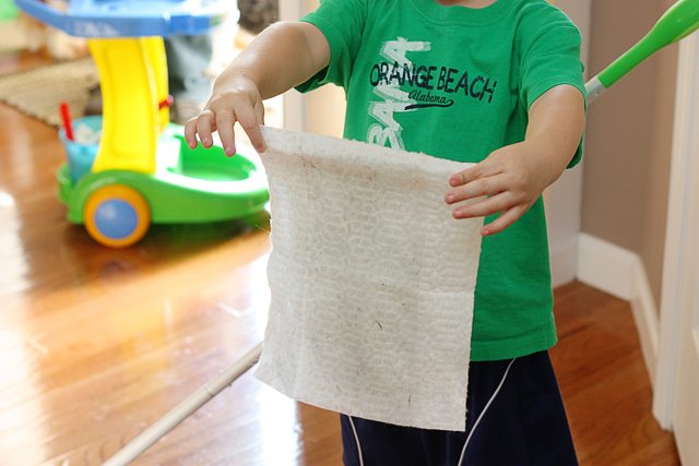 Jonah showing off his dirty Swiffer floor wipe! He was such a big helper.