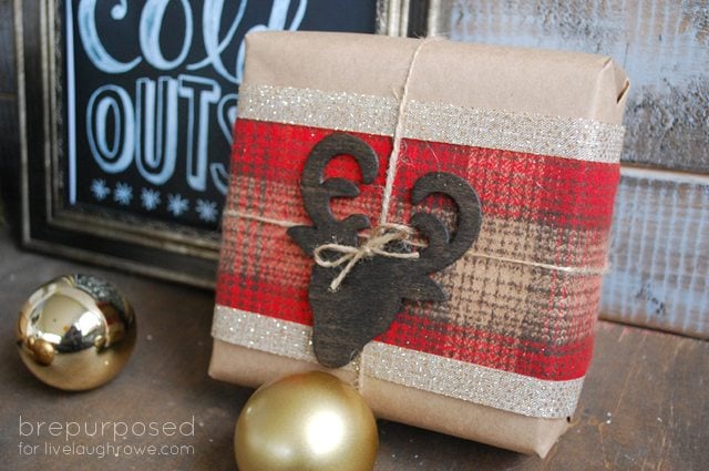 DIY Rustic Christmas Wrapping using flannel fabric, stain, feather and MORE!!  By Bre Purposed for www.livelaughrowe.com