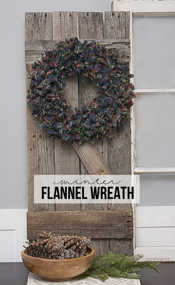A super easy Winter Flannel Wreath using strips of plaid flannel fabric to create a sense of warmth and add some pops of color! www.livelaughrowe.com