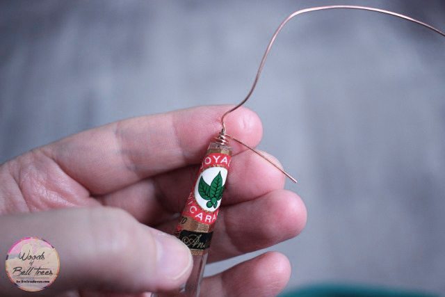 Wrapping the wire around the chandelier crystal and cigar band.