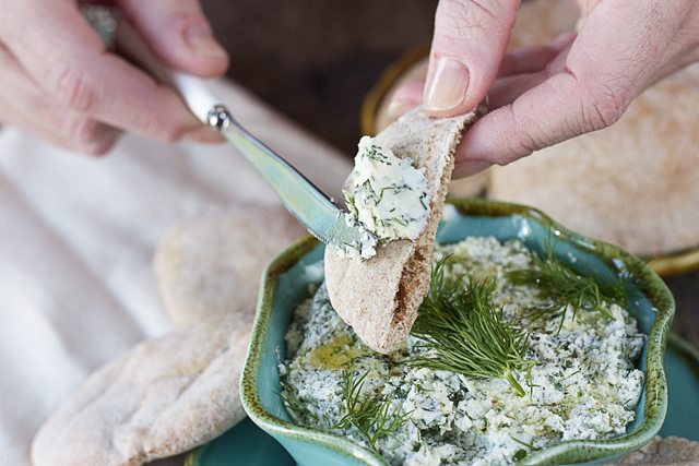 Delicious Herbed Feta Spread.  A perfect pairing with pita bread or crackers for an appetizer or snack!!  BONUS:  Serve with a glass of dry white wine! www.livelaughrowe.com