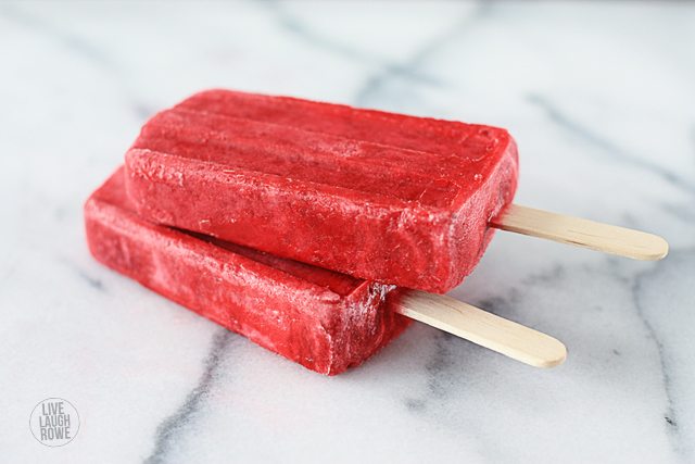 Raspberries and Cream Popsicles. The perfect frozen treat on a hot summer day! Recipe at livelaughrowe.com