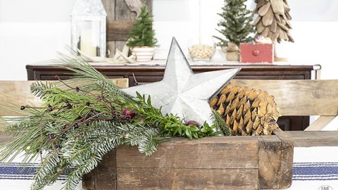 Lovely Christmas centerpiece using a vingtage box, greenery and a galvanized star. livelaughrowe.com