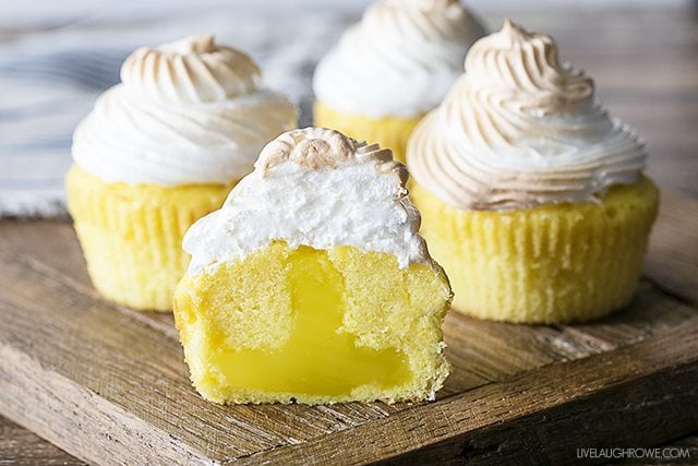 A cheery and delicious treat! These Lemon Meringue Cupcakes have a surprise filling that make it a perfect spin off of the classic Lemon Meringue Pie. livelaughrowe.com