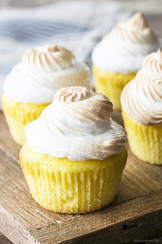 A cheery and delicious treat! These Lemon Meringue Cupcakes have a surprise filling that make it a perfect spin off of the classic Lemon Meringue Pie. livelaughrowe.com