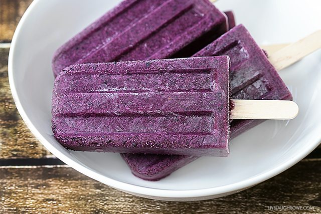 Blueberry Cheesecake Popsicles are the perfect icy treat on a stick for the blueberry lover. Fruit and dairy all in one too! livelaughrowe.com