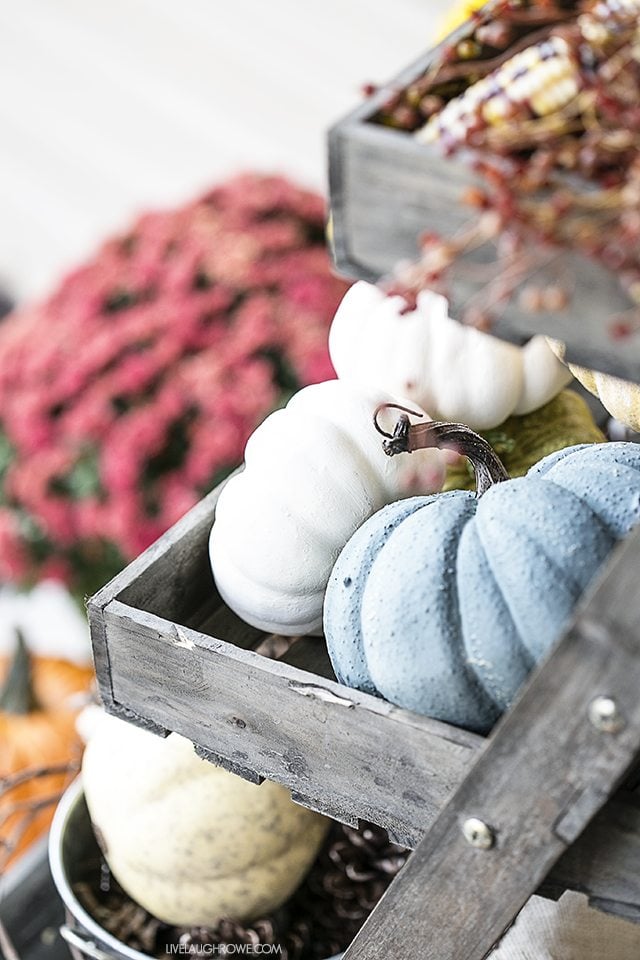Fall Front Porch Decor to inspire you! Colorful Pumpkins, Corn Husks and a lovely sitting area. livelaughrowe.com
