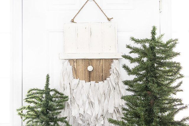 Add this Rustic Santa Door Hanger to your holiday decor -- it's simple to make and such a fun addition to your home or front door! livelaughrowe.com