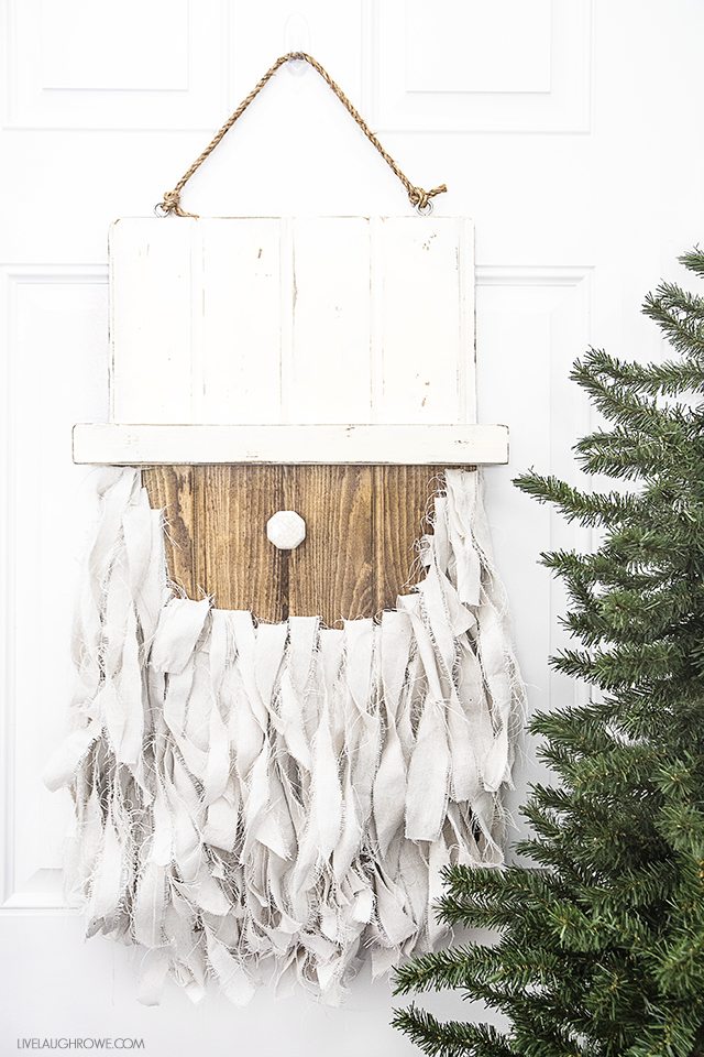 Add this Rustic Santa Door Hanger to your holiday decor -- it's simple to make and such a fun addition to your home or front door! livelaughrowe.com