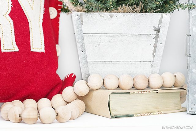 Beautiful and Simple Holiday Farmhouse Entryway -- loving the use of the wood bead garland. livelaughrowe.com