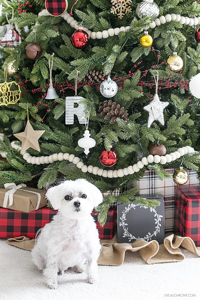 A simple rustic Christmas tree using wool felt balls for garland and splashes of plaid. Love the mix of the old and the new too. livelaughrowe.com