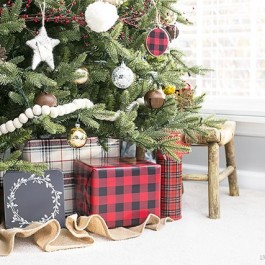 Simple rustic Christmas tree using wool felt balls for garland and splashes of plaid. Love the mix of the old and the new too. livelaughrowe.com