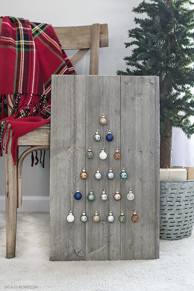 Step by step instructions on how to build a simple, rustic Shiplap Ornament Display. A great addition to your rustic, farmhouse holiday decor -- and you can change out the ornaments! livelaughrowe.com