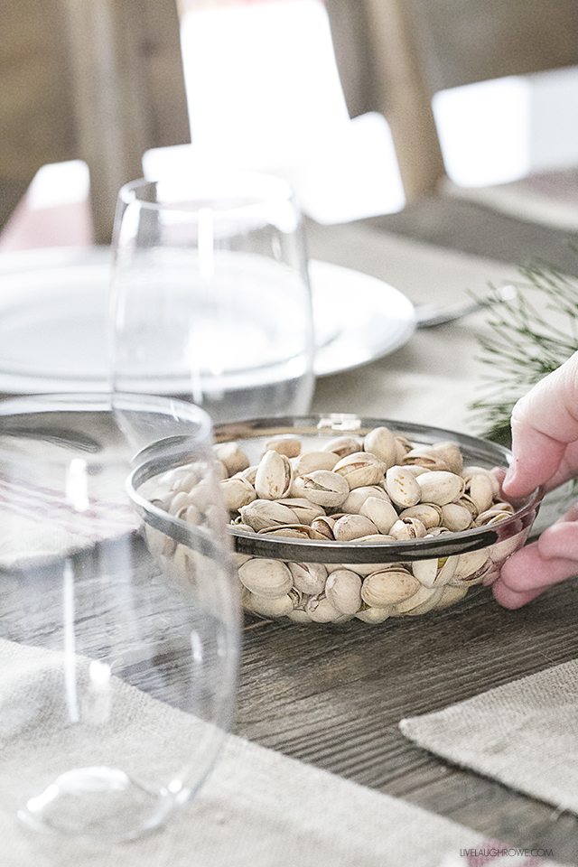 Can you believe that this is disposable dinnerware? Yep! This Rustic Christmas Tablescape is created with style and low maintenance, meaning less stress! livelaughrowe.com