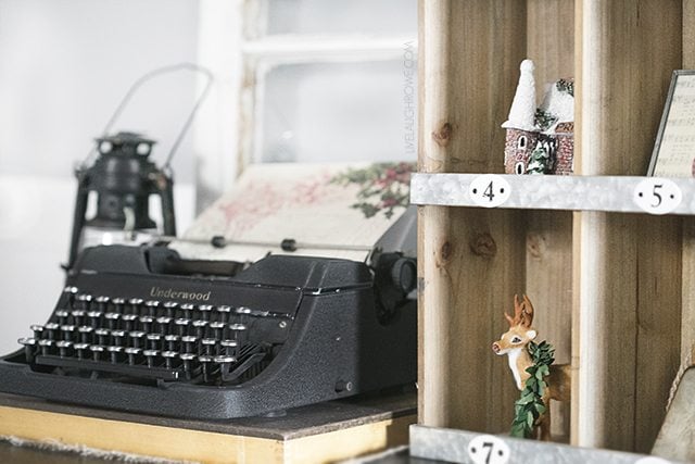 Beautiful vintage inspired Christmas Dining Room decor! That old typewriter, sled and the wreath of vintage Christmas cards are perfect! livelaughrowe.com