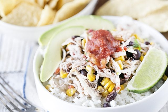 Simple Chicken Burrito Bowl made in the slow cooker. Easy and delicious? Yes, please! livelaughrowe.com