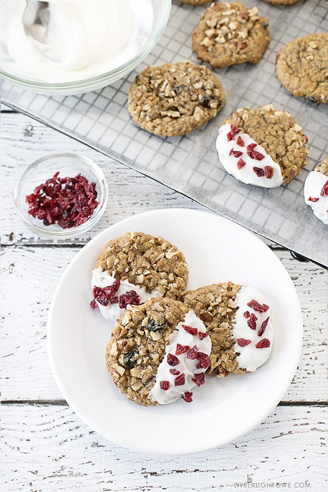 Super EASY and delicious cookies. White Chocolate Dipped Oatmeal Raisin Cookies. Recipe at livelaughrowe.com