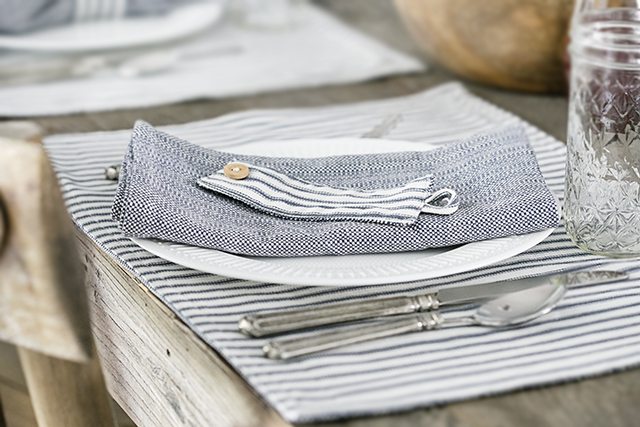 Beautiful farmhouse inspired tablescape using linens with blue ticking stripes. Simple, yet elegant in it's own way. livelaughrowe.com