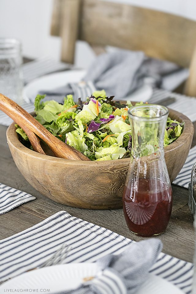 Beautiful farmhouse inspired tablescape using linens with blue ticking stripes. Simple, yet elegant in it's own way. livelaughrowe.com