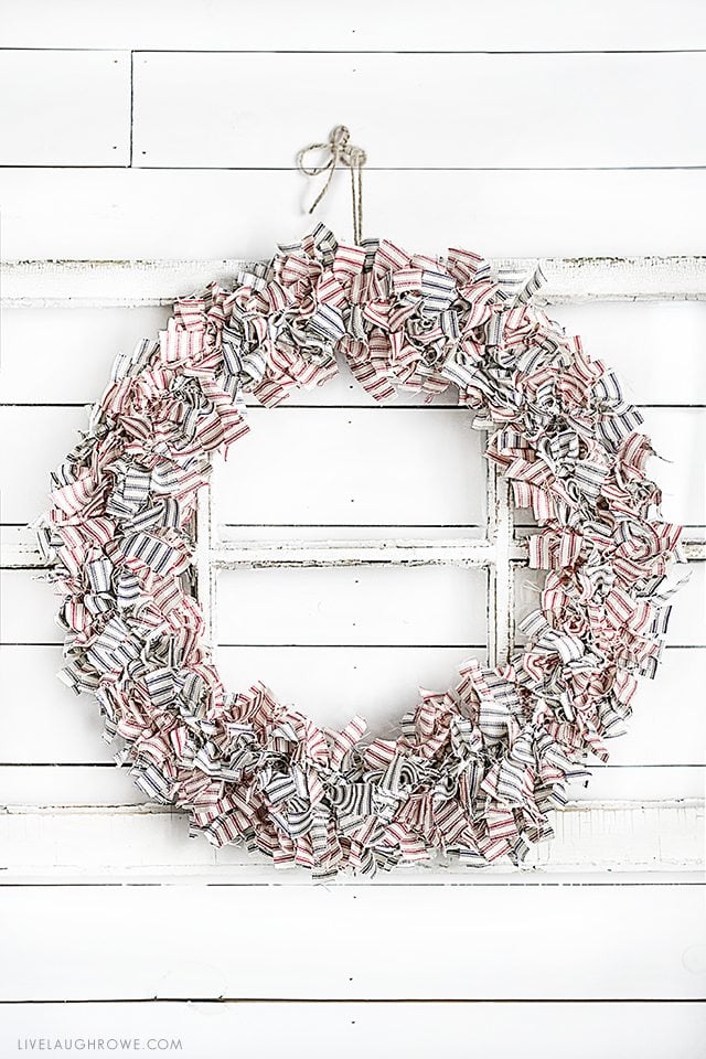 Farmhouse Inspired Patriotic Wreath made using ticking fabric in navy and red. Love it! livelaughrowe.com