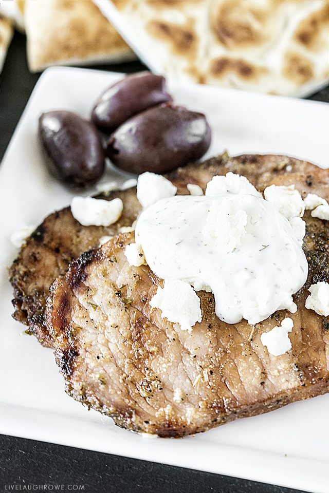 These greek pork chops are packed with flavor and are easy enough for a last-minute dinner! Serve with your favorite greek toppings and greek pita bread. livelaughrowe.com