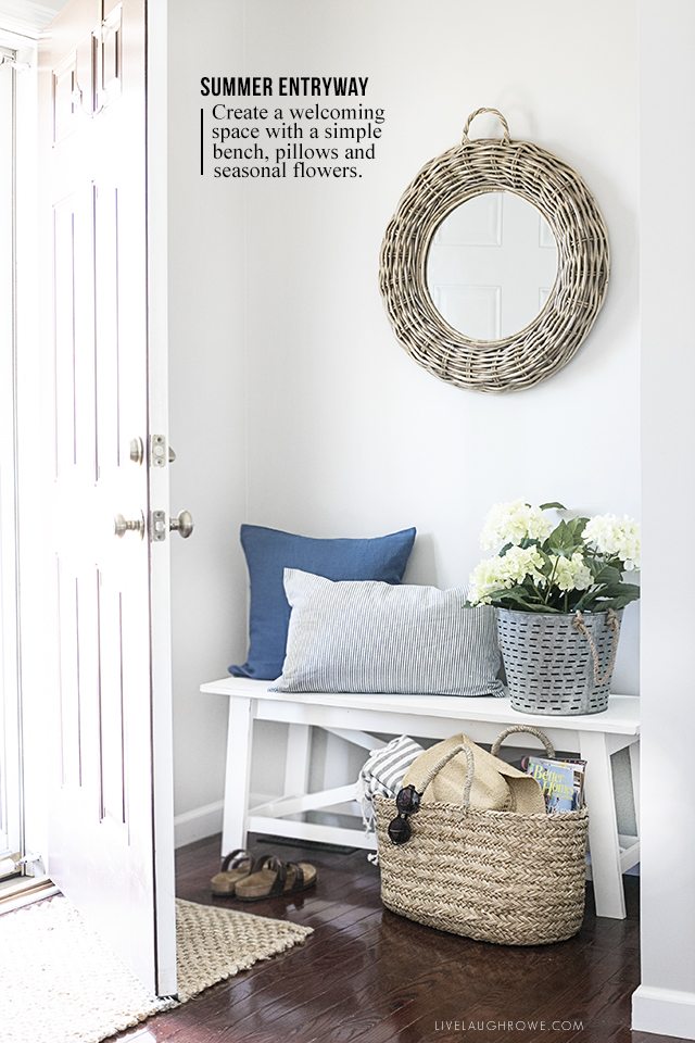 A simple summer entryway with shades of blue and seasonal flowers create a warm and welcoming space. livelaughrowe.com