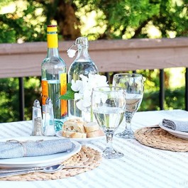Enjoy a date night dining alfresco in your own backyard. This lifestyle blogger created a simple table setting to enjoy a delicious meal outdoors with her husband. More details at livelaughrowe.com