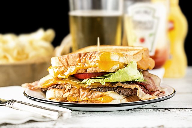 This Grilled Cheese Bacon Burger from livelaughrowe.com looks to be packed with some of my favorites. One flavorful burger coming right up.