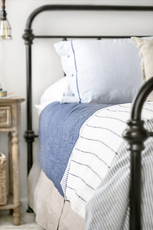 Farmhouse Inspired Master Bedroom Makeover. Perfectly light, bright and so many beautiful pieces. See all the details at livelaughrowe.com