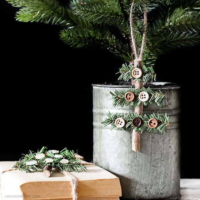 Kelly of Live Laugh Rowe created this simple, rustic Holiday Ornament using a stick, faux pine stem and buttons. This wooden tree would also make a great gift accessory! Find the full tutorial at livelaughrowe.com