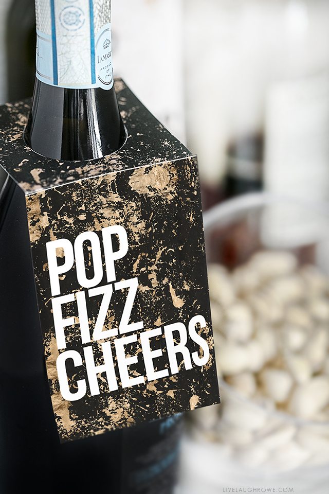 Pop Fizz Cheers! Whether it's for a birthday celebration, engagement party or New Years Eve -- these printable bottle tags are sure to bring a little extra fun to the party! livelaughrowe.com