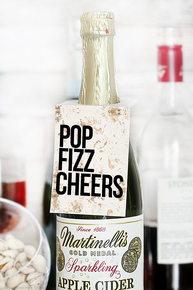 Pop Fizz Cheers! Whether it's for a birthday celebration, engagement party or New Years Eve -- these printable bottle tags are sure to bring a little extra fun to the party! livelaughrowe.com