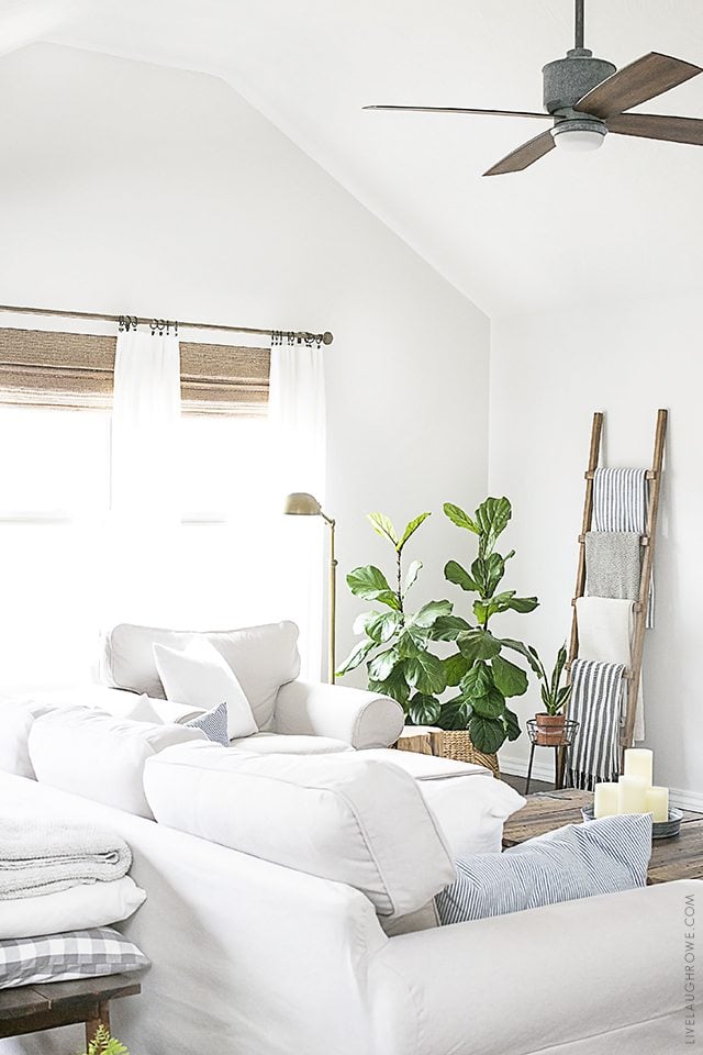 Beautiful neutral window treatments with farmhouse flare! From Levolor Natural shades to linen curtains, the space is bright and inviting. Learn more at livelaughrowe.com