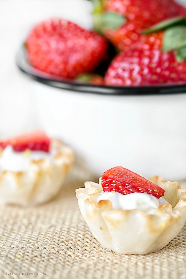 Lemon, cheese and berries make a delicious trio. These bite-size Lemon Cheesecake Tarts are guilt free way to satisfy your sweet tooth. Did I mention this is a Weight Watchers dessert with only one point per tart. Recipe at livelaughrowe.com