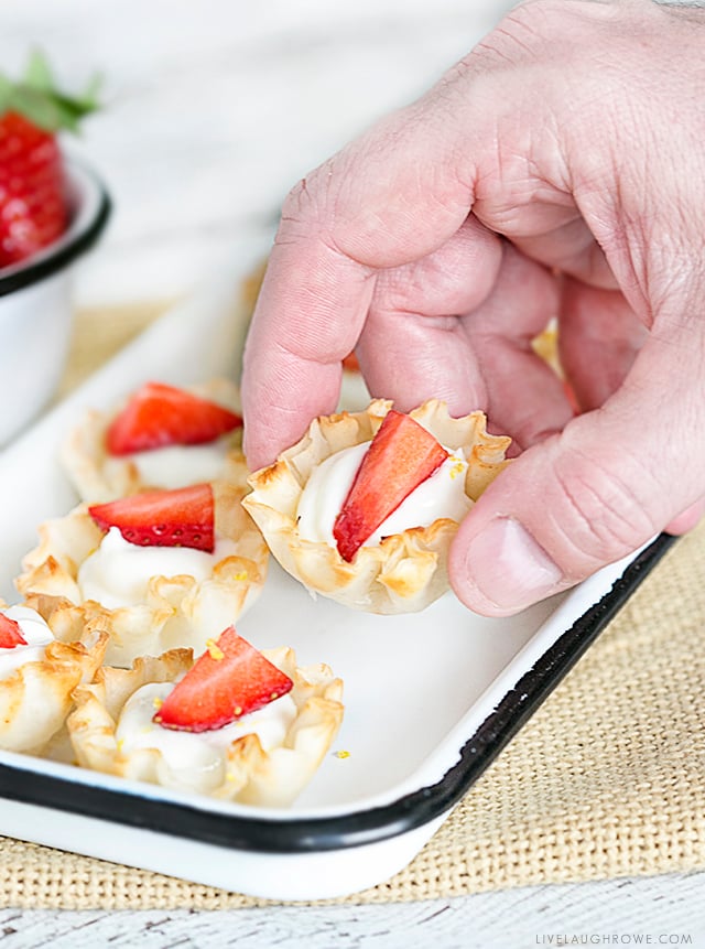 Lemon, cheese and berries make a delicious trio. These bite-size Lemon Cheesecake Tarts are guilt free way to satisfy your sweet tooth. Did I mention this is a Weight Watchers dessert with only one point per tart. Recipe at livelaughrowe.com