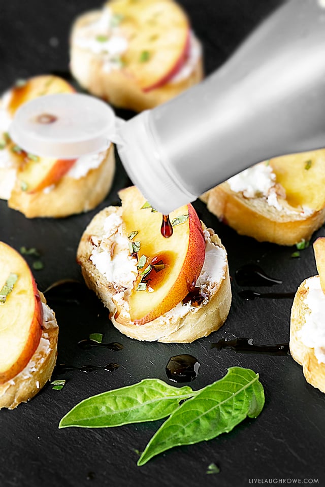 An appetizer that will impress the palates of your friends. Peach Crostini with Goat Cheese and other flavorful ingredients. Simple and delicious! Recipe at livelaughrowe.com