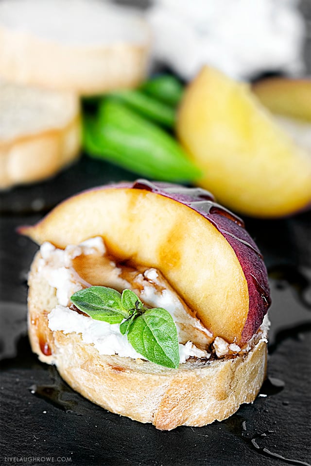 An appetizer that will impress the palates of your friends. Peach Crostini with Goat Cheese and other flavorful ingredients. Simple and delicious! Recipe at livelaughrowe.com